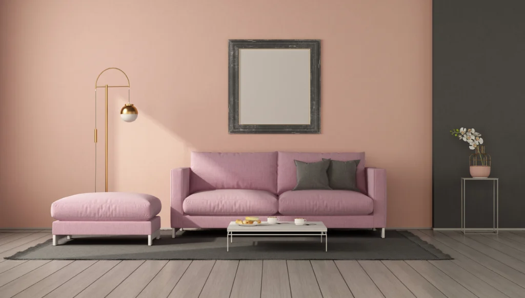 Čistý obývací pokoj po profesionální úklidové službě s růžovou stěnou a moderním nábytkem.